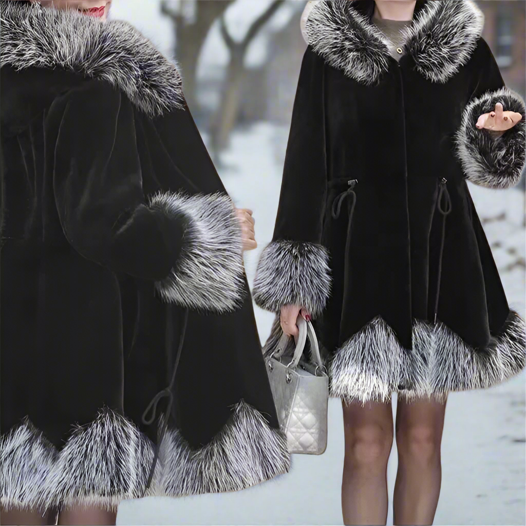Black coat with fur trim worn by a person in a snowy setting
