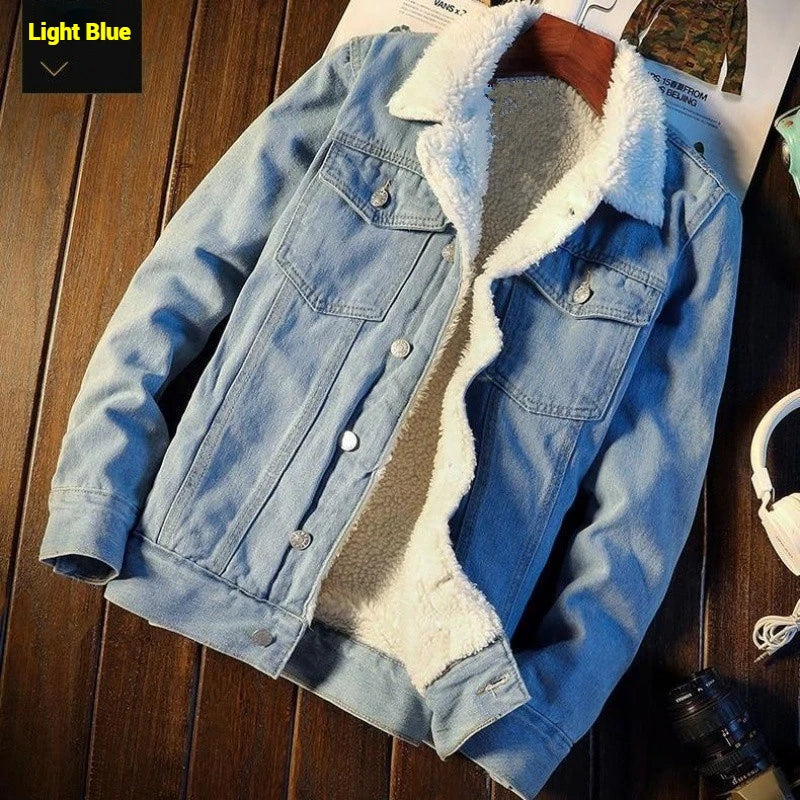 Light blue denim jacket with white fleece lining on a wooden surface