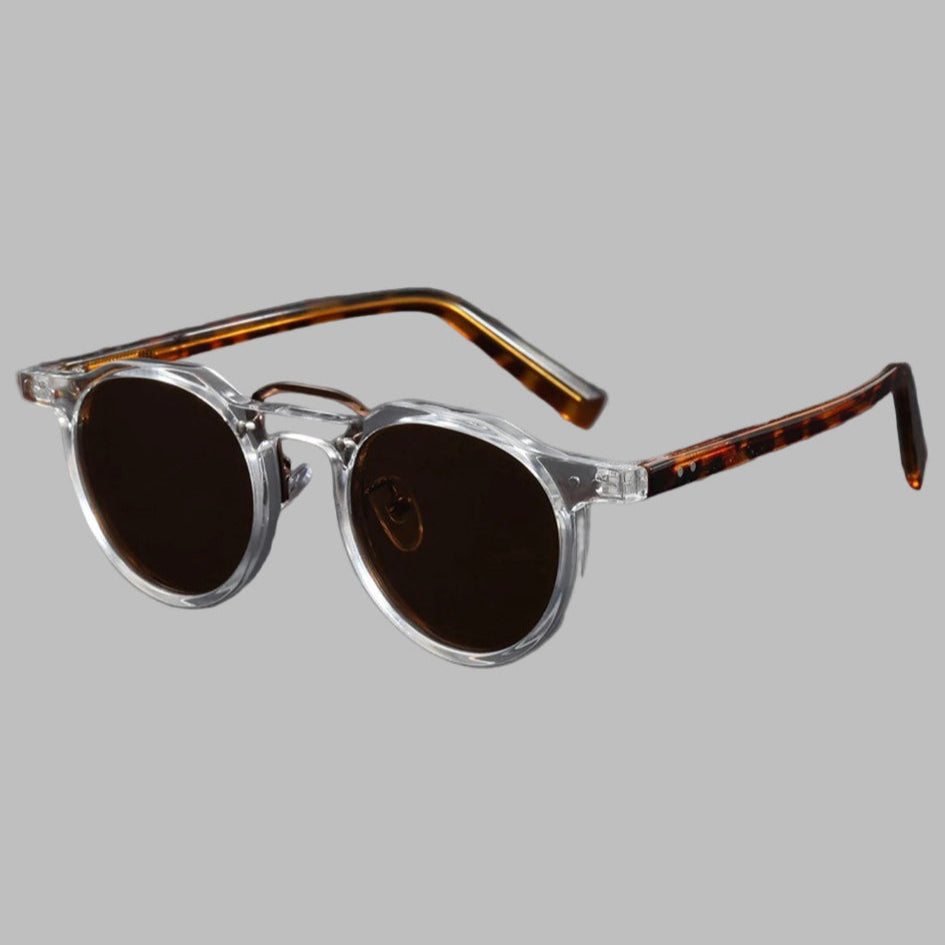 Round sunglasses with tortoiseshell frame on a gray background