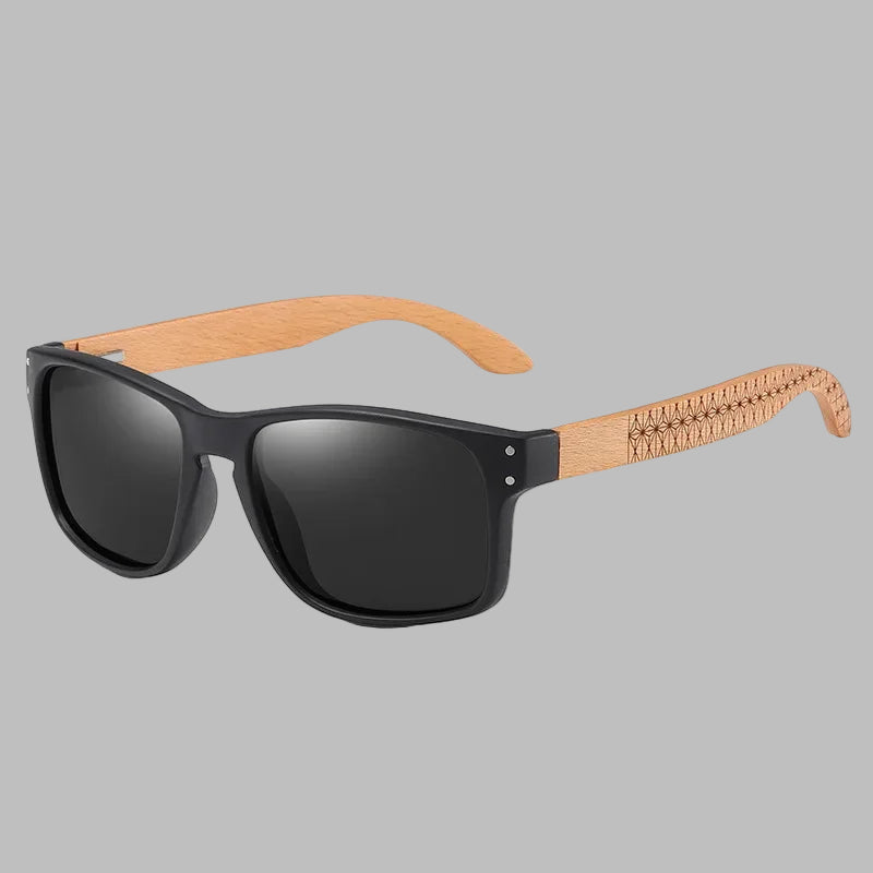 Sunglasses with black lenses and wooden frame on a white background
