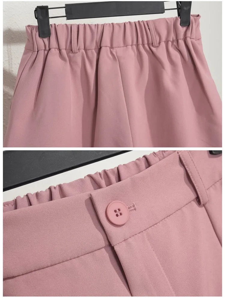 Close-up of a pink skirt with an elastic waistband and button detail.