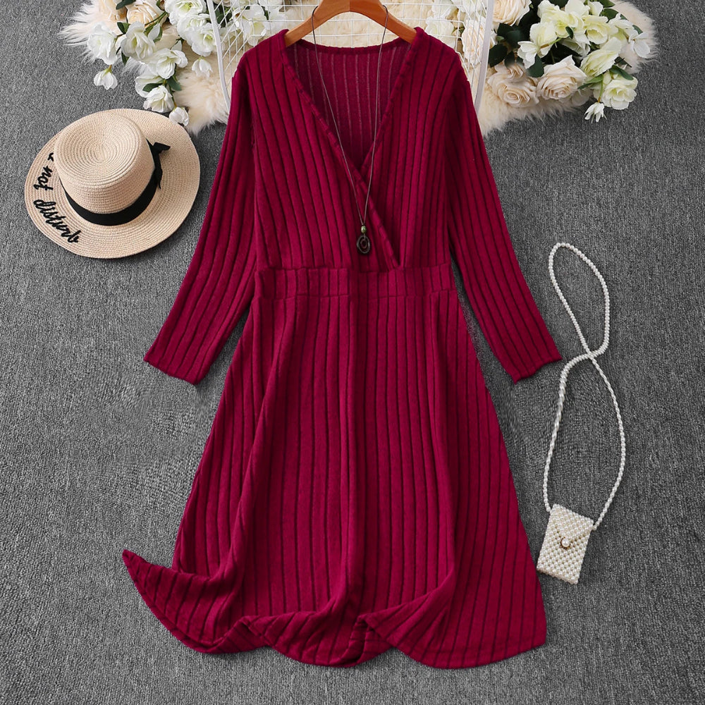 Red ribbed dress with a hat and handbag on a gray surface