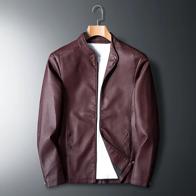 Brown leather jacket on a hanger against a gray background