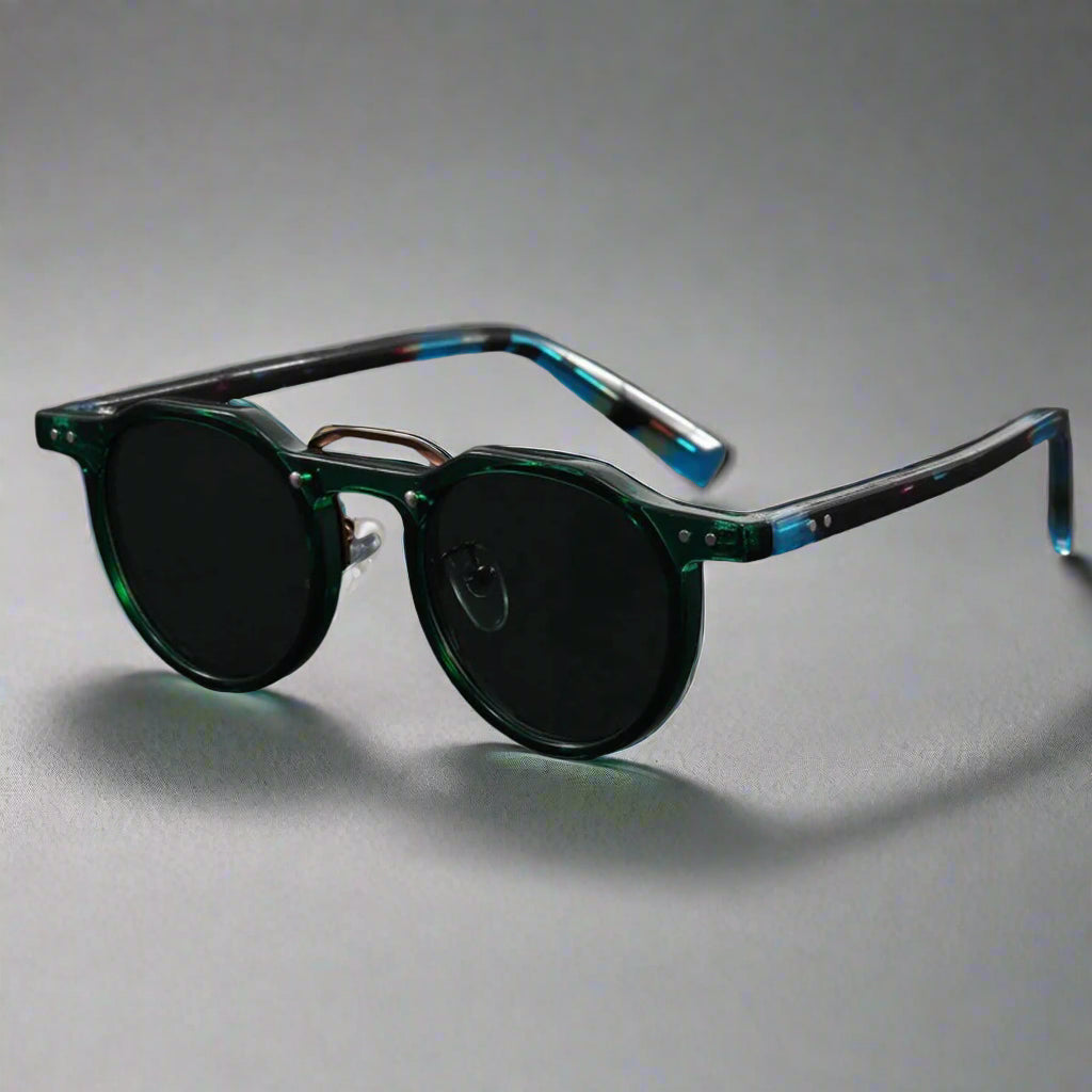 Sunglasses with green and blue frame on a dark gray background