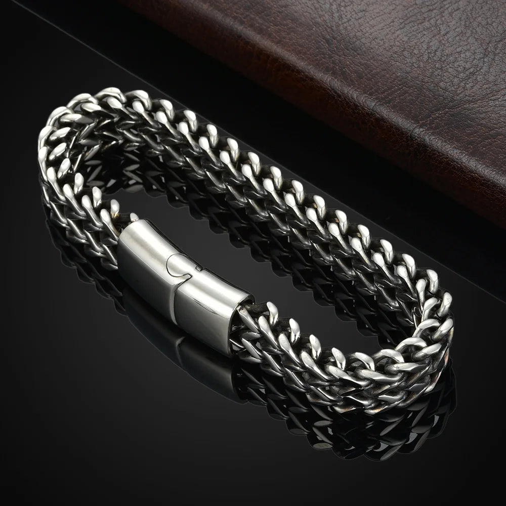 Silver braided bracelet on a dark background