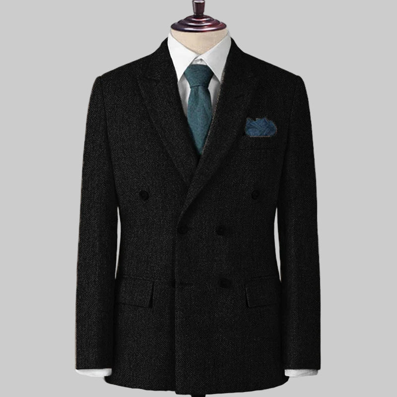 Black double-breasted suit jacket on a mannequin with a white shirt, green tie, and pocket square.