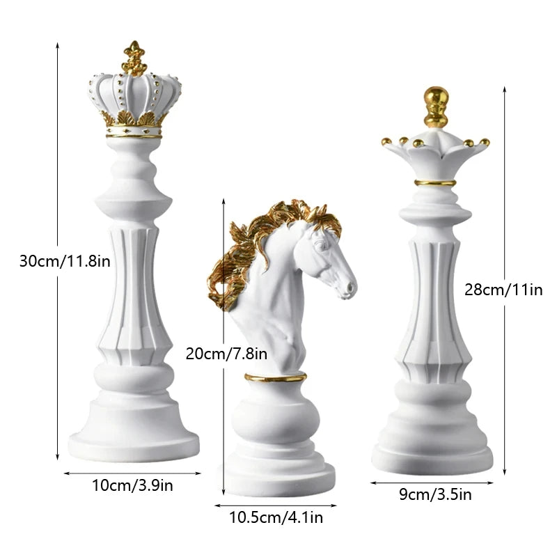 White chess pieces with gold crowns and decorations, including a king, queen, and horse, with measurements indicated.