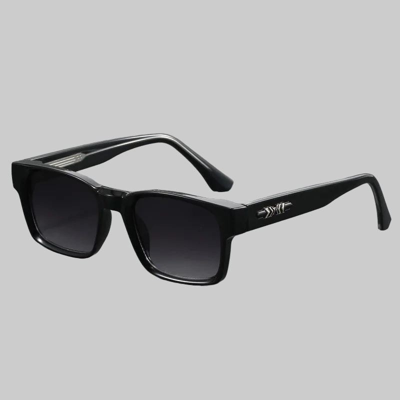 Black sunglasses with a brand logo on a gray background