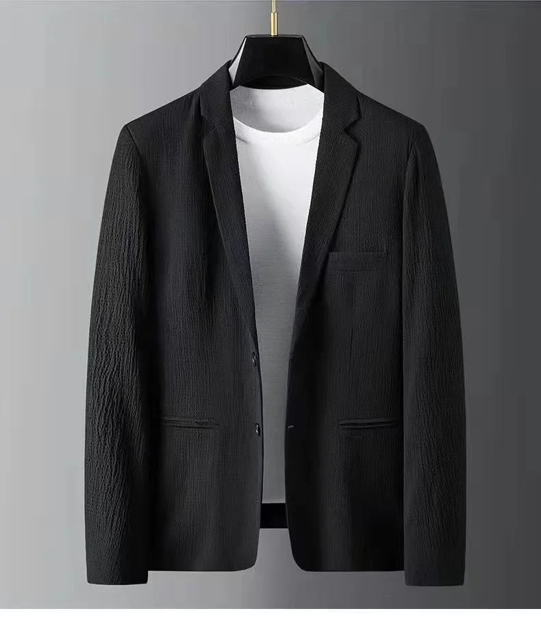 Black blazer on a gray background