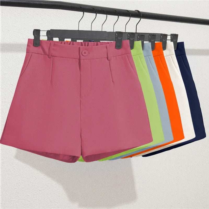 Colorful shorts on a hanger against a white background