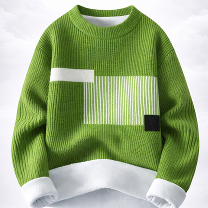 Green sweater with white and black design on a white background