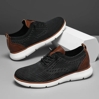 Black and brown sneakers with white soles on a gray background