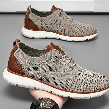 Gray and brown sneakers with white soles on a gray background