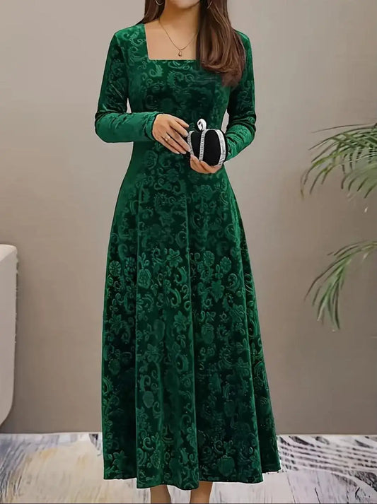 Green lace dress worn by a person against a neutral background