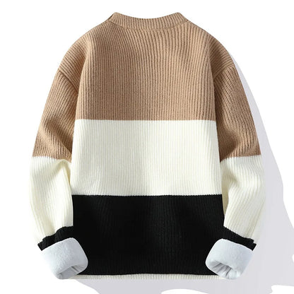 Color-blocked sweater with brown, white, and black sections on a white background