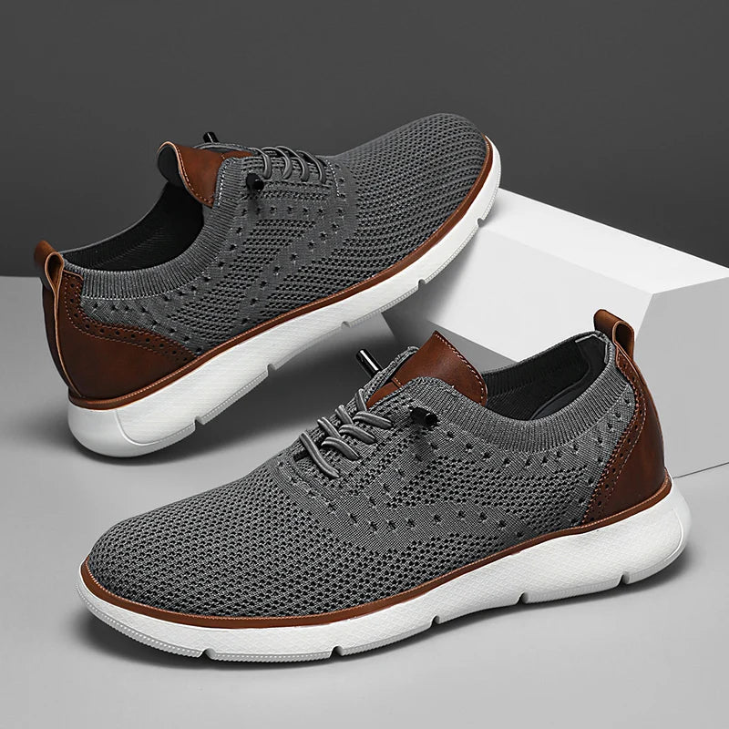 Gray sneakers with brown accents on a gray background