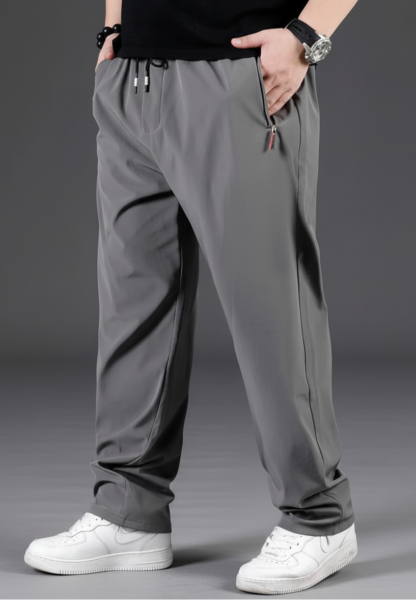 Gray pants worn by a person on a dark background with text about fashion and clothing styles.