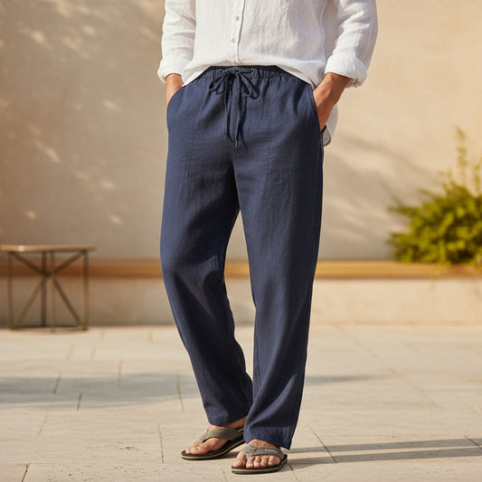 Navy blue pants worn by a person on a white background