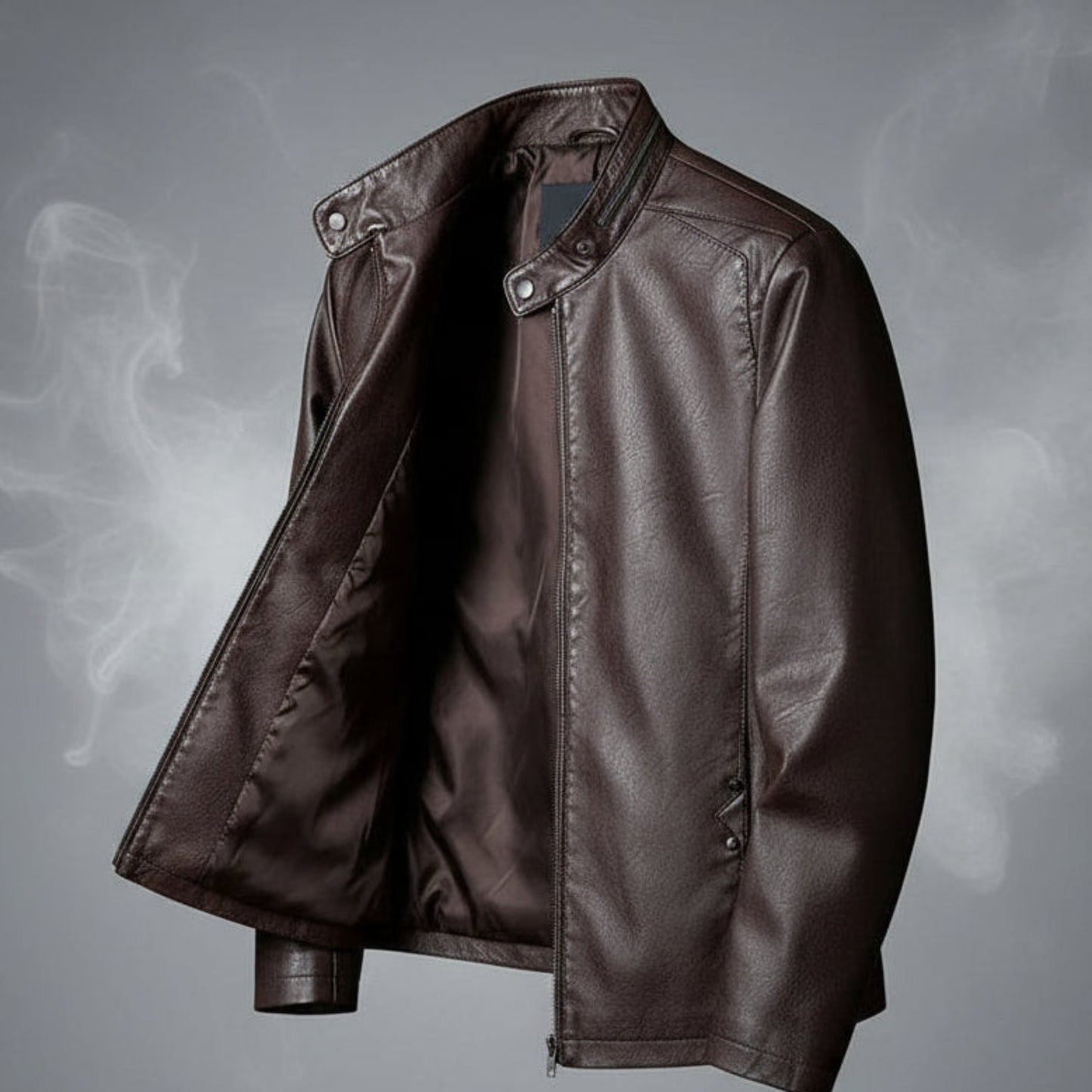 Brown leather jacket on a hanger against a gradient gray background