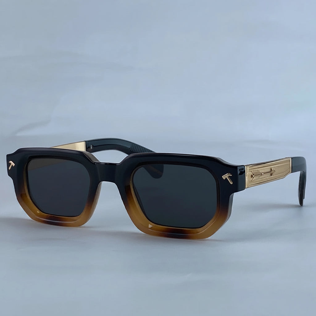 Sunglasses with tortoiseshell frame and gold accents on a light gray background, featuring the brand 'KIM7KIM'.