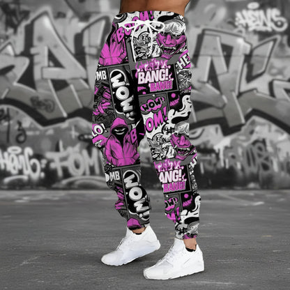 Colorful graphic jogger pants with text and patterns on a gray background