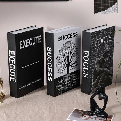 Three books titled 'Execute', 'Success', and 'Focus' on a surface with decorative items.