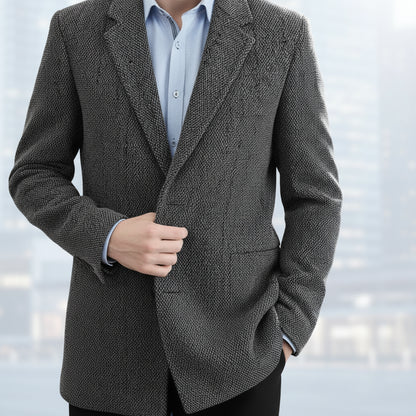 Gray textured coat worn by a person on a white background