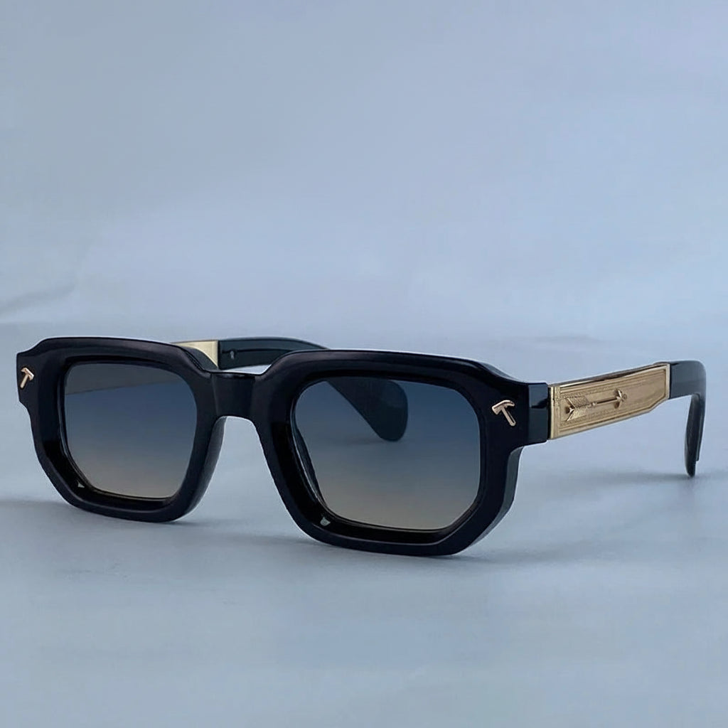 Black sunglasses with gold accents on a light gray background, featuring the brand 'KIM7KIM'.