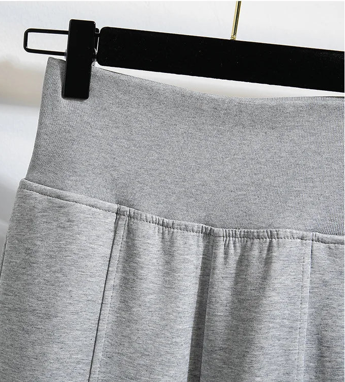 Gray pants with a black belt on a white background