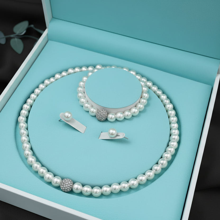 Pearl necklace and earrings set in a jewelry box
