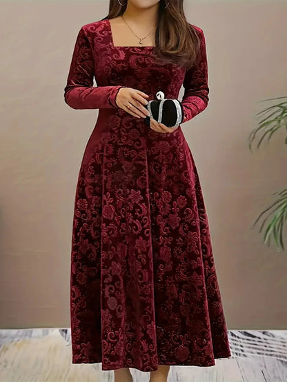 Red lace dress worn by a person against a neutral background