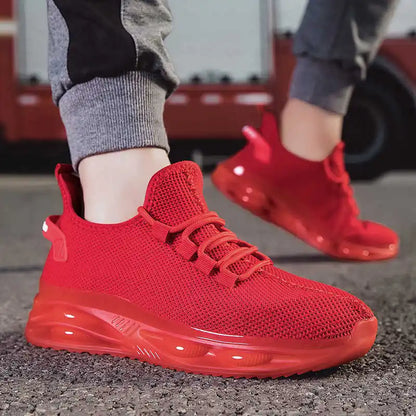 Red sneakers worn on a blurred background