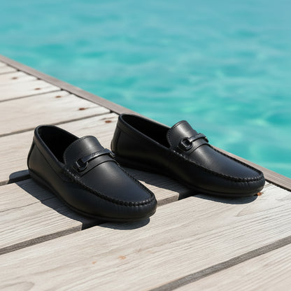 Black loafers worn by a person with text on comfort and style.