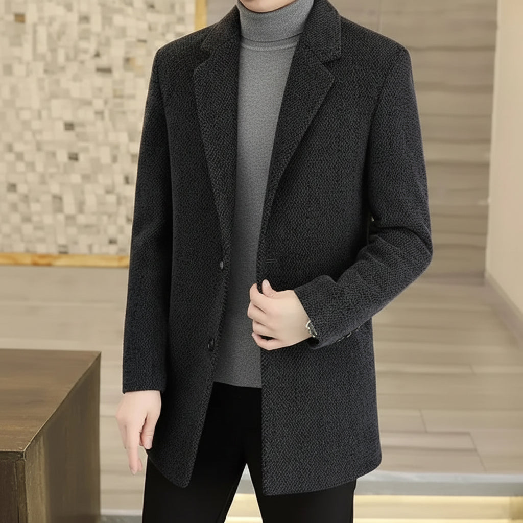 Person wearing a dark gray coat with a flame graphic and text about adding cotton and thickening.