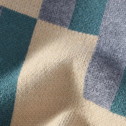 Close-up of a textured fabric with blue and beige checkered pattern