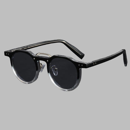 Black sunglasses with clear temple tips on light gray background