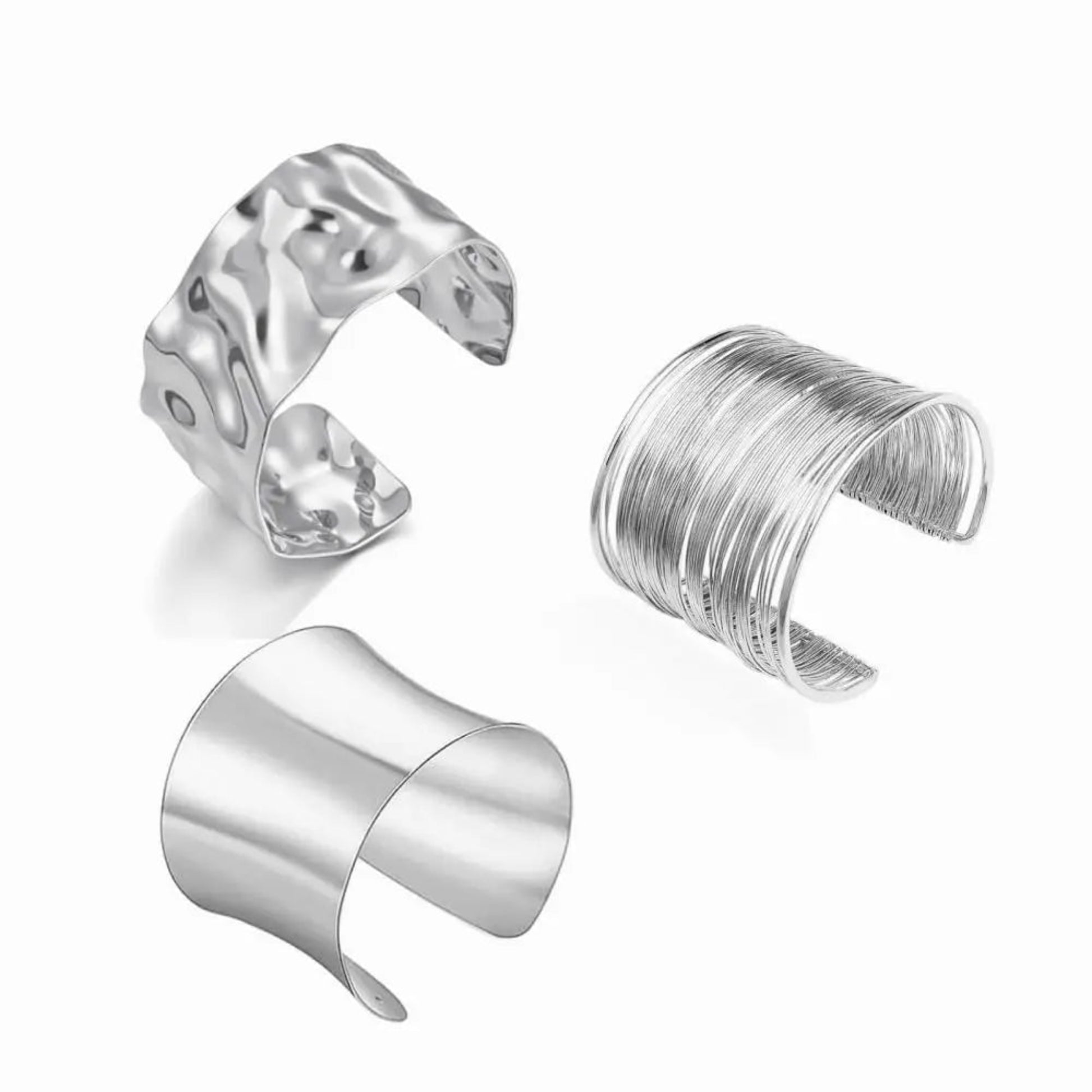 Three silver cuff bracelets on a white background
