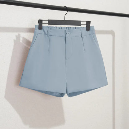 Light blue shorts on a hanger against a white background