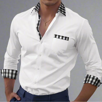 White shirt with black and white checkered details worn by a person.