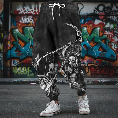 Black shorts with a graphic design of a skeleton on a motorcycle against a textured wall.