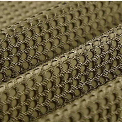 Close-up of green mesh fabric with 'Leisure' text in the corner