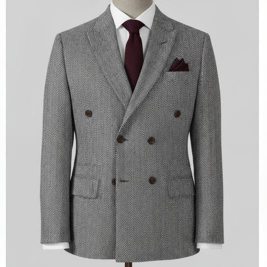 Light Gray herringbone suit jacket with a white shirt and burgundy tie on a mannequin against a light gray background.