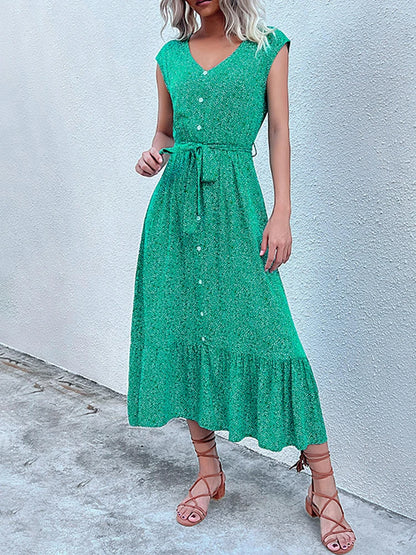 Woman wearing a green dress with a white background