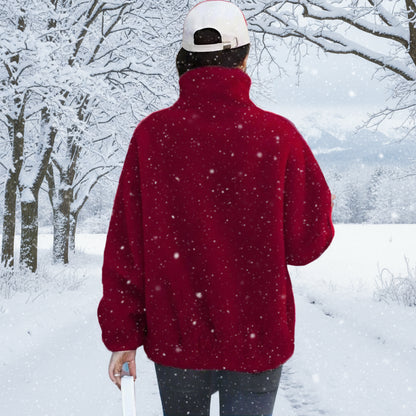 Person wearing a red jacket and white cap walking past a store with 'Mobilia' branding.