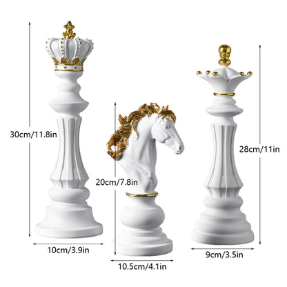 White chess pieces with gold crowns and decorations, including a king, queen, and horse, with measurements indicated.