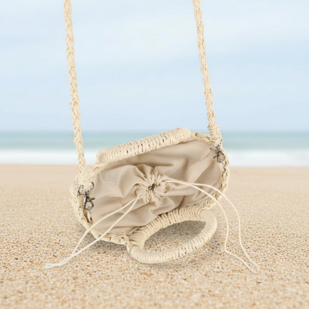 Woven handbag with a drawstring on a striped background