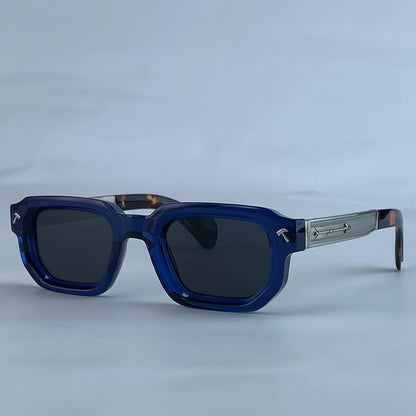 Blue sunglasses with a silver frame on a light gray background, featuring the brand 'KIM7KIM'.
