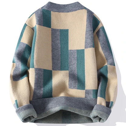 Checkered sweater with blue, green, and beige pattern on a white background