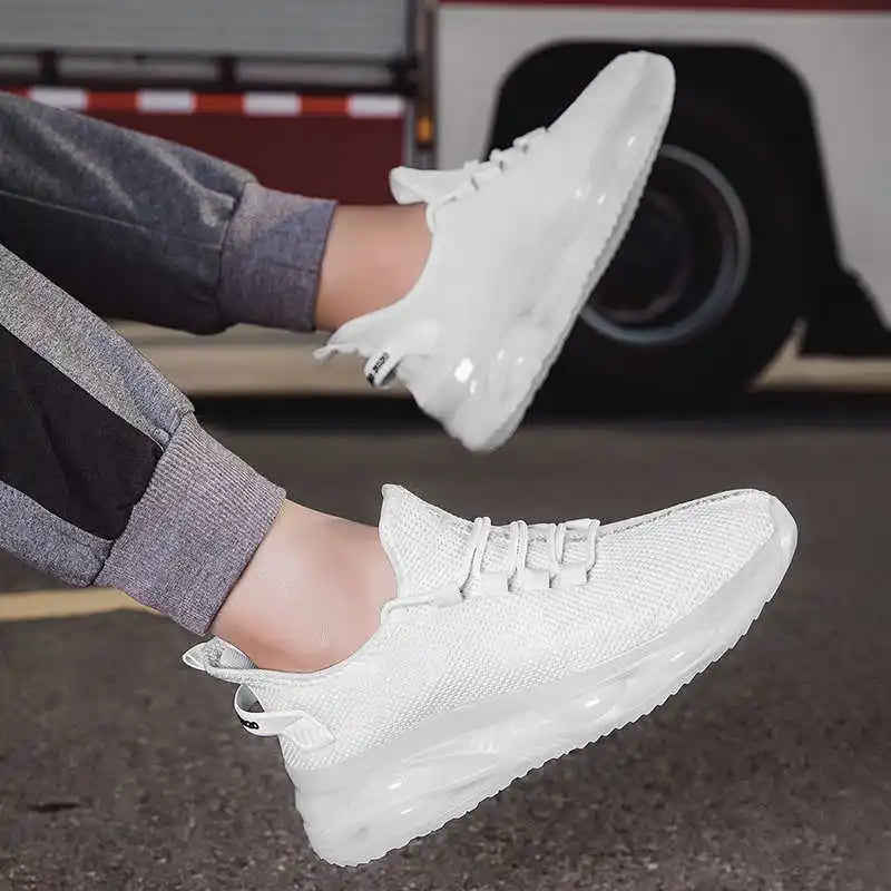 White sneakers worn by a person with a blurred background