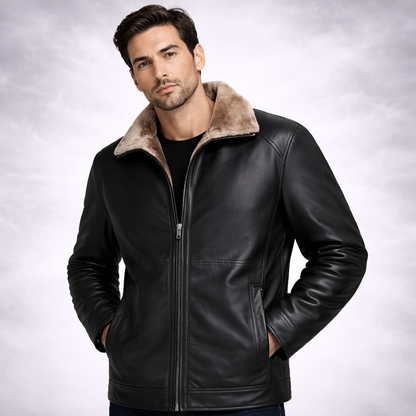Man wearing a black leather jacket with a fur-lined collar on a light gray background